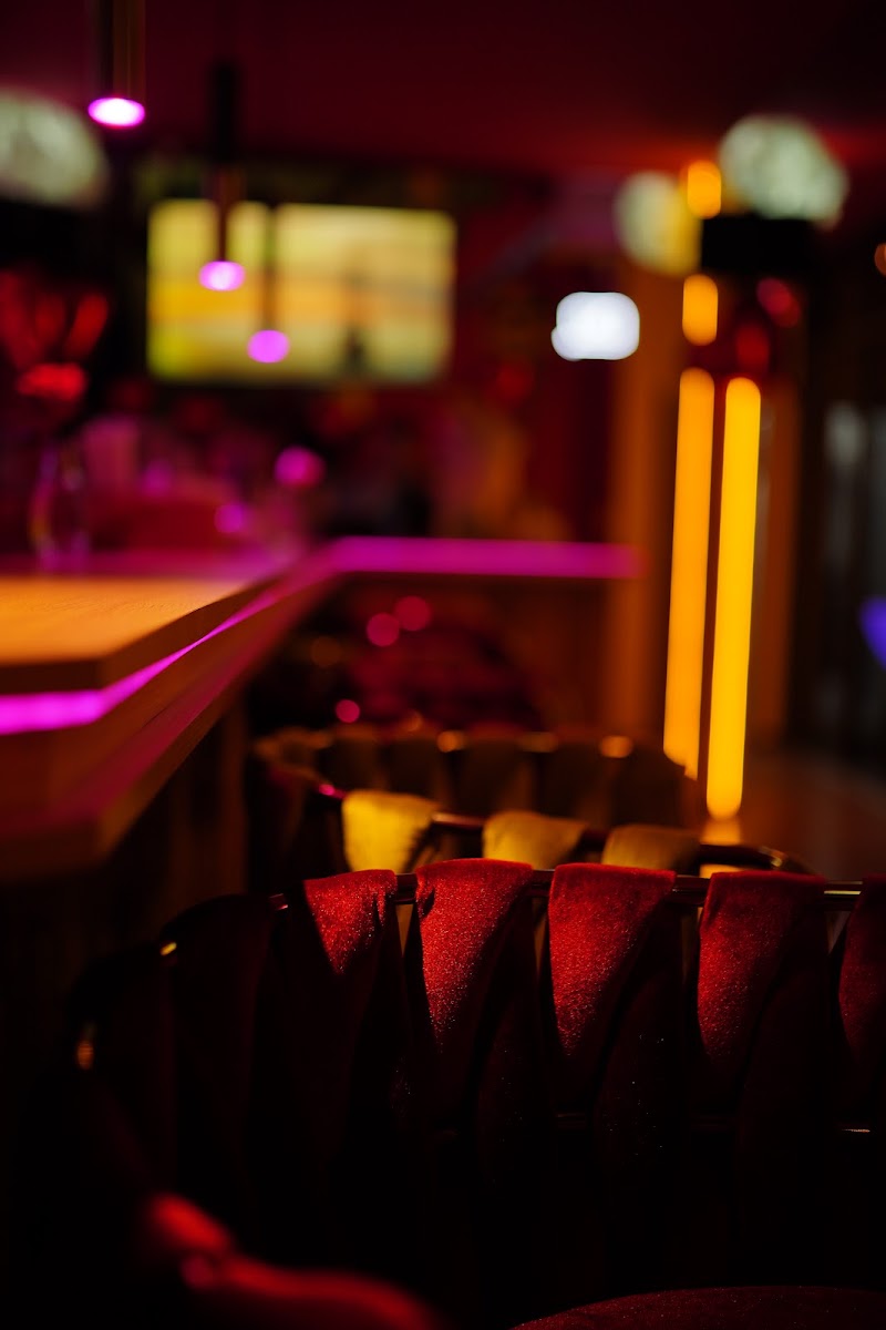 A close atmospheric view across the bar seating at OneMore